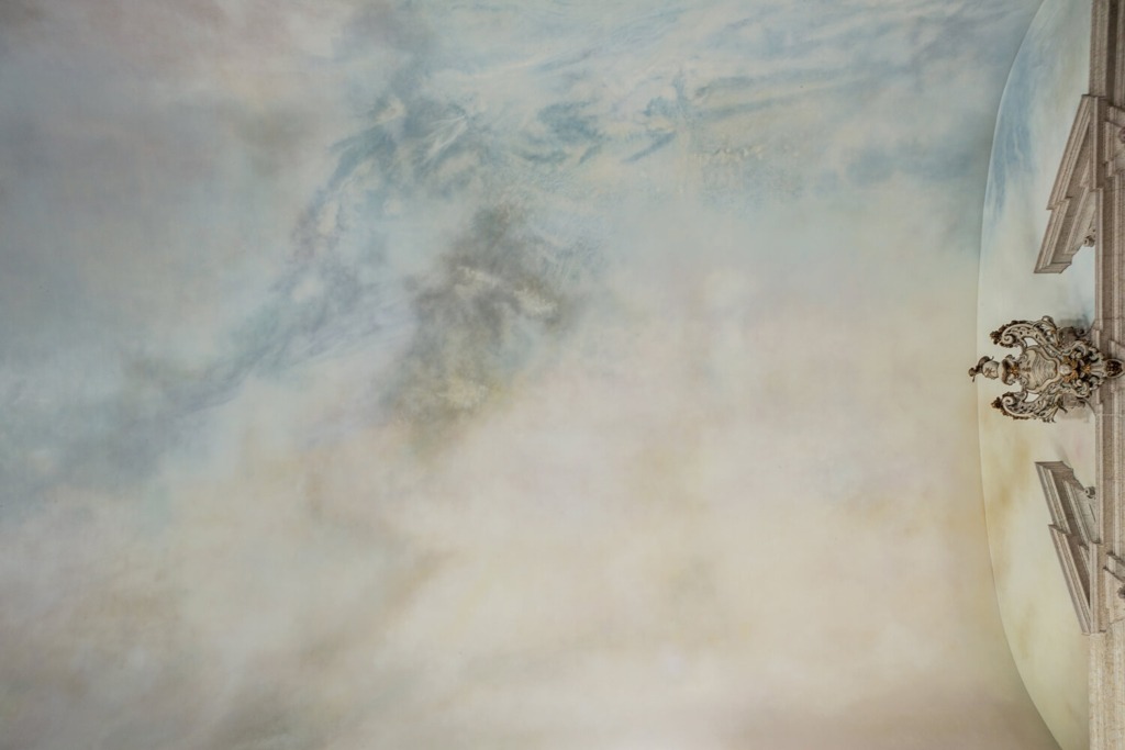 Detail photo of the sky painted on the ceiling of the church by the artist Michael Biberstein